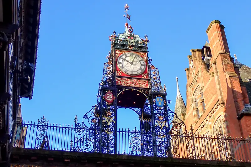 The ornate Eastgate Clock above the Eastgate arch in warm evening sun