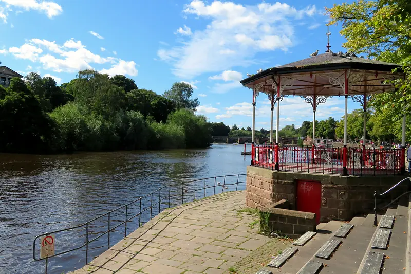 The bandstand on the Groves beside the River Dee on a bright day